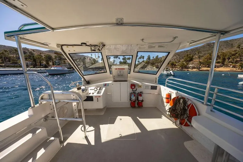 Slide: The Image of 2018 Seahawk Island Hopper boat interior with ocean view and safety equipment. - 13