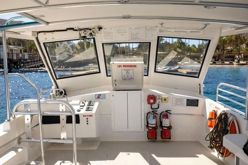 Slide: The Image of Interior of a 2018 Seahawk Island Hopper boat with safety equipment and controls. - 8