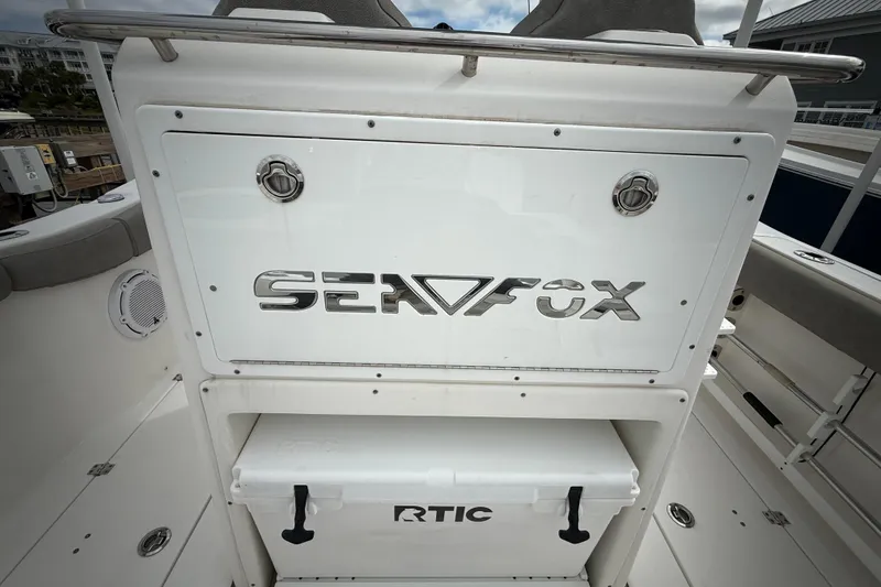 Slide: The Image of 2022 Sea Fox 288 Commander boat interior with RTIC cooler and branded panel. - 23
