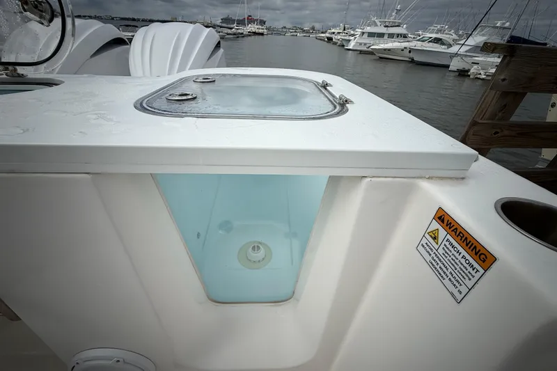 Slide: The Image of 2022 Sea Fox 288 Commander boat with livewell and warning label at marina. - 28