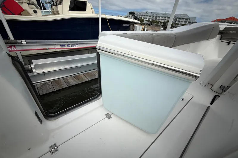 Slide: The Image of 2022 Sea Fox 288 Commander boat interior with seating and storage compartment. - 29