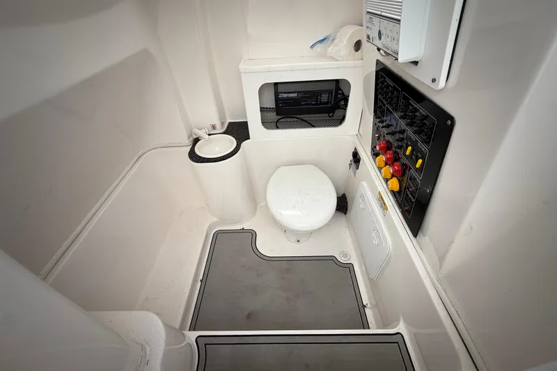 Slide: The Image of 2022 Sea Fox 288 Commander boat interior with toilet and control panel. - 30