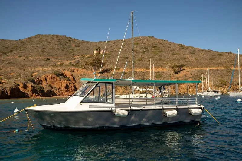 Slide: The Image of 2019 Seahawk Island Hopper boat anchored in scenic coastal waters. - 1