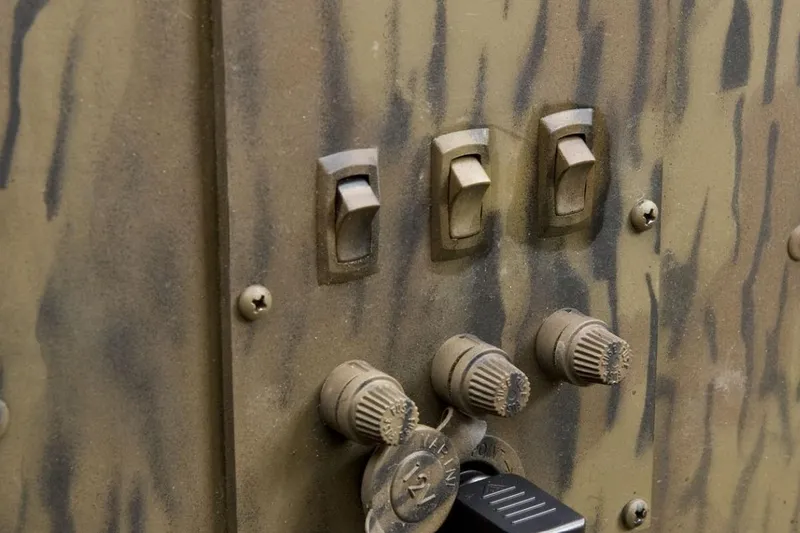 Slide: The Image of Camouflage panel with switches and knobs, G3 16DK model, 2026 design. - 12