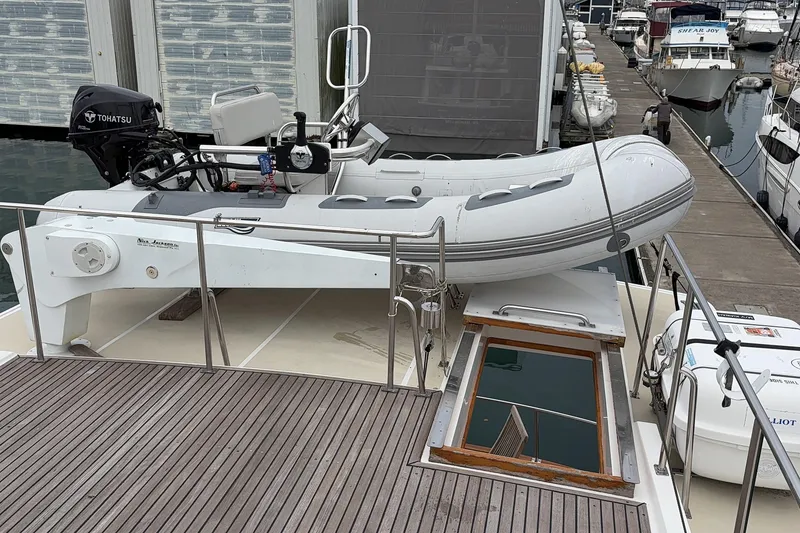 Slide: The Image of Inflatable boat with steering console, docked near Grand Banks 52 Europa, 1998 model. - 10