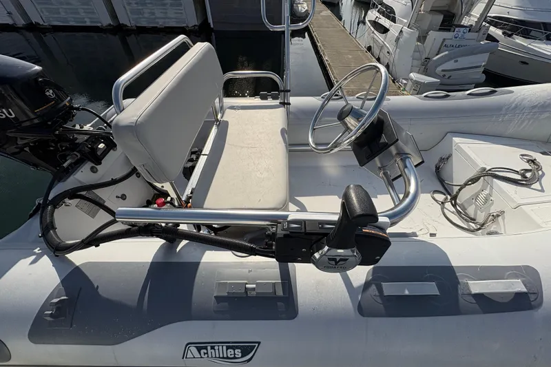 Slide: The Image of 1998 Grand Banks 52 Europa yacht docked with safety equipment visible. - 13