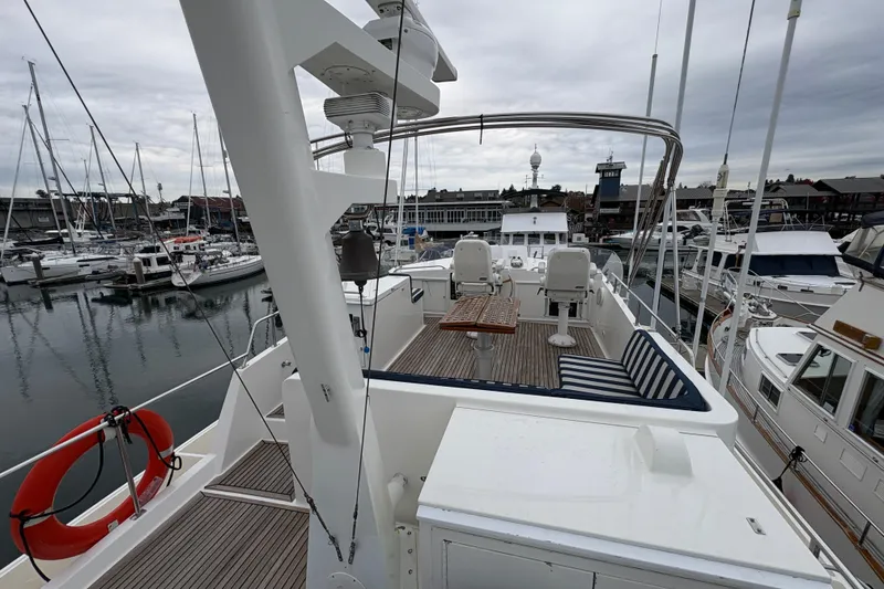 Slide: The Image of 1998 Grand Banks 52 Europa yacht docked at marina, surrounded by other boats. - 15