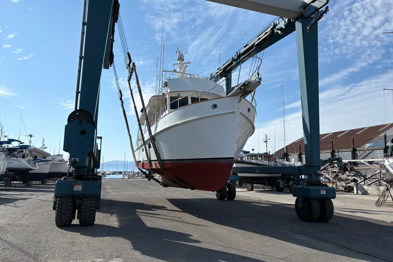 Slide: The Image of Bow of 1998 Grand Banks 52 Europa yacht with anchor and winch at dock. - 17