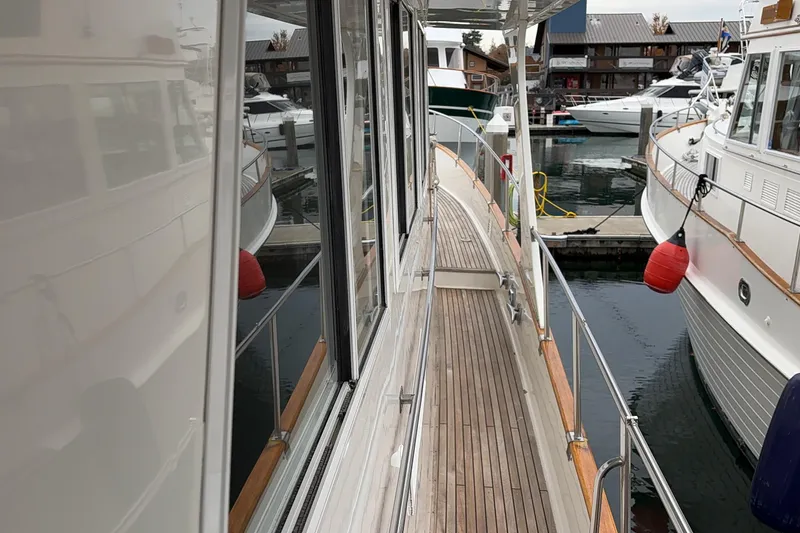 Slide: The Image of Grand Banks 52 Europa yacht from 1998 being lifted by a marine travel lift. - 19