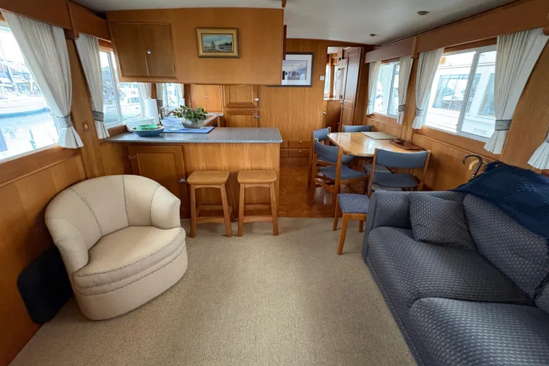 Slide: The Image of Side deck view of a 1998 Grand Banks 52 Europa yacht at a marina. - 21