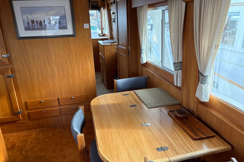 Slide: The Image of Interior of 1998 Grand Banks 52 Europa yacht with dining area and kitchen. - 23