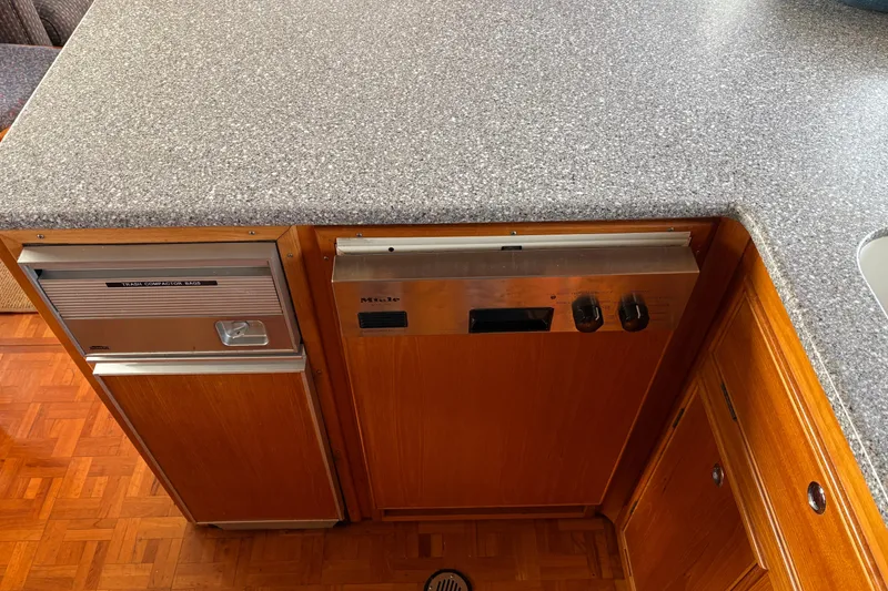 Slide: The Image of Kitchen area of 1998 Grand Banks 52 Europa yacht with stove and sink. - 26