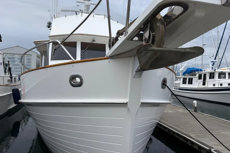 Slide: The Image of 1998 Grand Banks 52 Europa yacht deck with seating and control panel. - 3