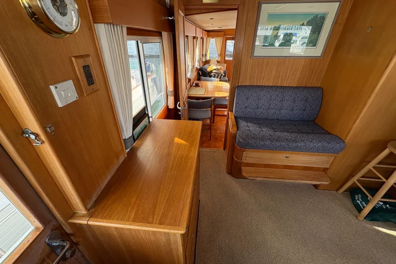 Slide: The Image of Interior of 1998 Grand Banks 52 Europa yacht with helm station and wooden cabinetry. - 30