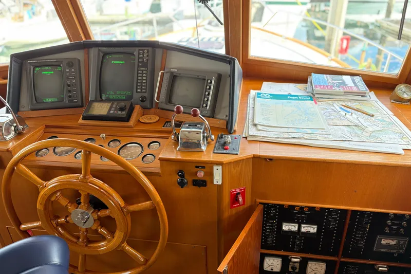 Slide: The Image of Interior of 1998 Grand Banks 52 Europa yacht with wood finish and seating area. - 31