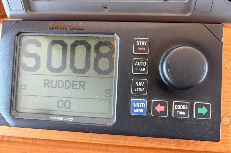 Slide: The Image of Interior of 1998 Grand Banks 52 Europa yacht with wooden stairs and blue captain's chair. - 33