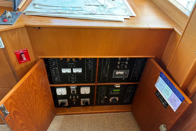 Slide: The Image of Control panel of a 1998 Grand Banks 52 Europa yacht with gauges and alarm indicators. - 38