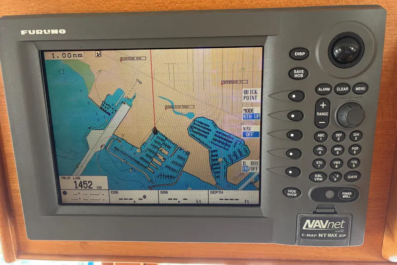 Slide: The Image of Electrical panel on 1998 Grand Banks 52 Europa yacht with navigation charts. - 39