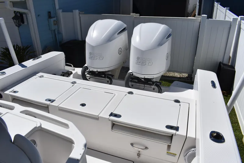 Slide: The Image of 2018 Everglades 273 Center Console with twin Yamaha 250 engines, rear deck view. - 10