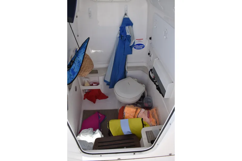 Slide: The Image of Interior of 2018 Everglades 273 Center Console boat with storage and toilet. - 21