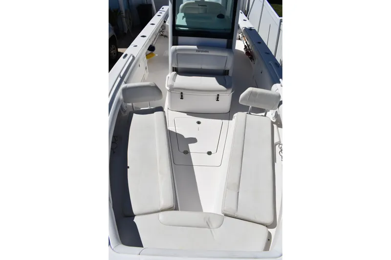 Slide: The Image of 2018 Everglades 273 Center Console boat interior with white seating and console. - 24