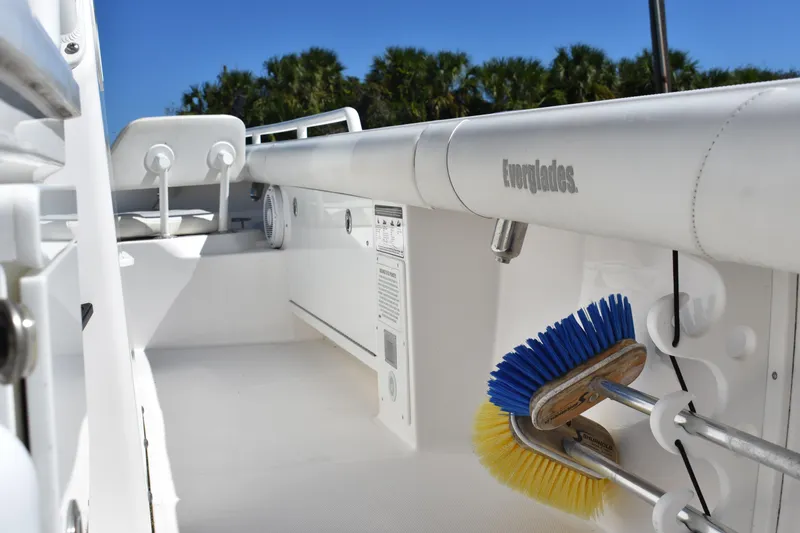 Slide: The Image of 2018 Everglades 273 Center Console boat interior with cleaning brushes and equipment. - 28
