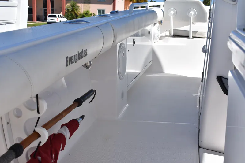 Slide: The Image of 2018 Everglades 273 Center Console boat interior with rod holders and seating. - 29