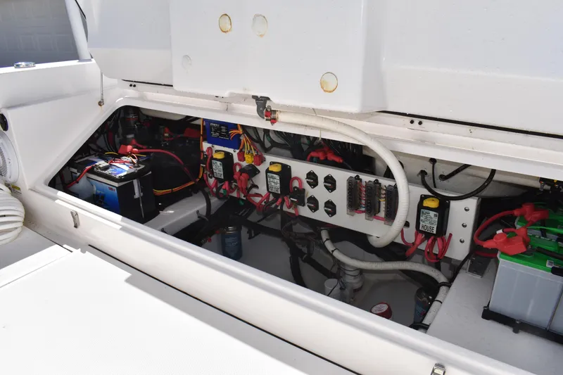 Slide: The Image of 2018 Everglades 273 Center Console boat electrical compartment with batteries and wiring. - 31