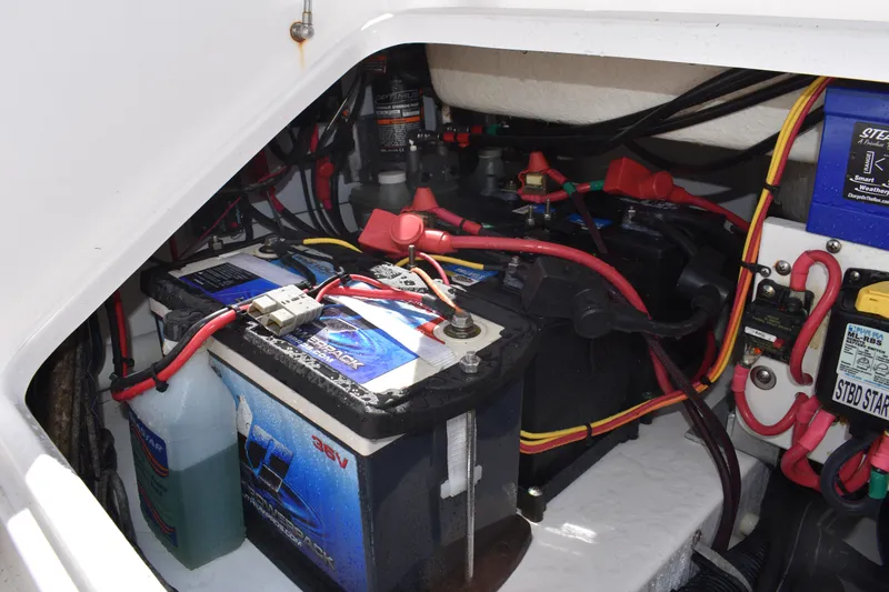 Slide: The Image of 2018 Everglades 273 Center Console boat battery compartment with wiring and components. - 34