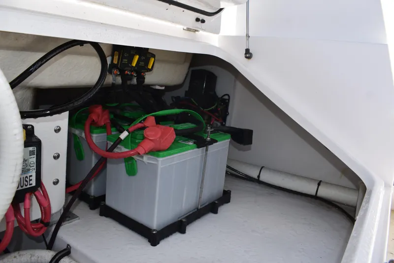 Slide: The Image of Battery compartment of 2018 Everglades 273 Center Console boat, showing wiring and connections. - 35