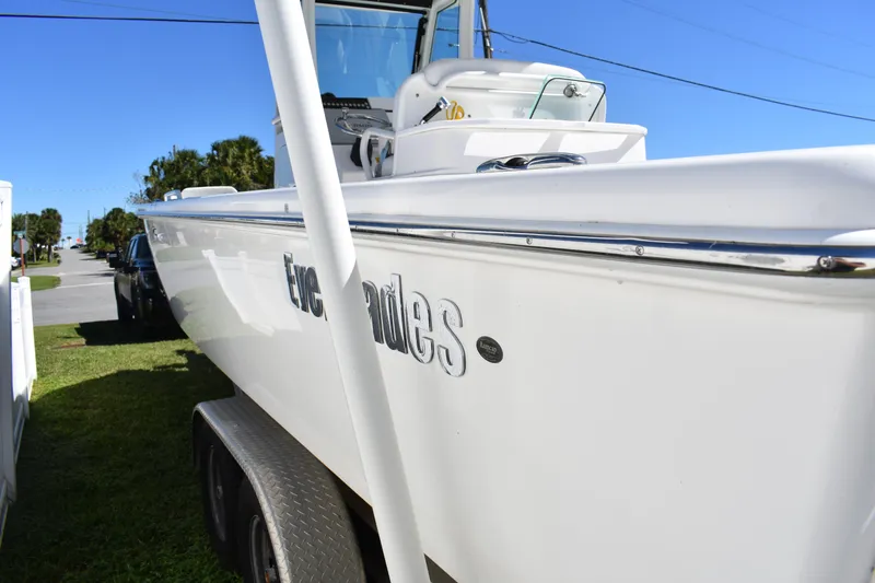 Slide: The Image of 2018 Everglades 273 Center Console boat parked on trailer, side view. - 4