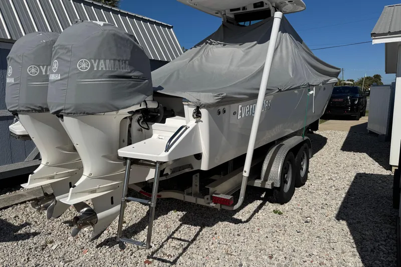Slide: The Image of 2018 Everglades 273 Center Console boat with Yamaha engines, covered and on a trailer. - 5