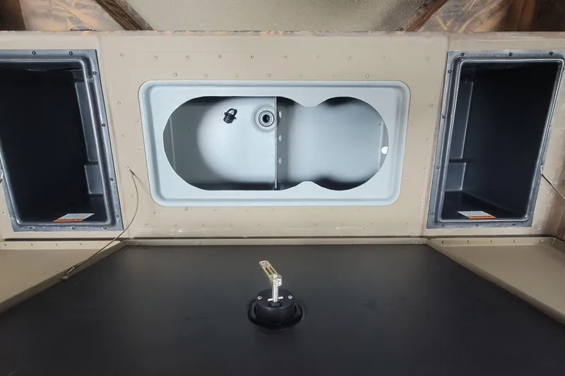 Slide: The Image of Interior of a 2026 G3 17CC boat featuring storage compartments and a central fixture. - 12