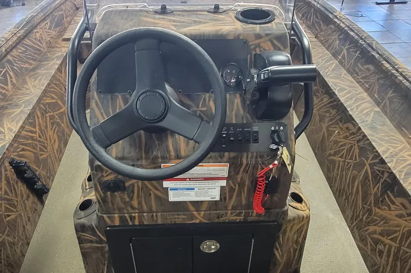 Slide: The Image of 2026 G3 17CC boat console with camouflage design and steering wheel. - 14