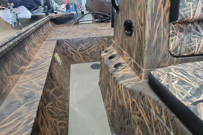 Slide: The Image of Camouflage interior of 2026 G3 17CC boat with seating and cup holders. - 16