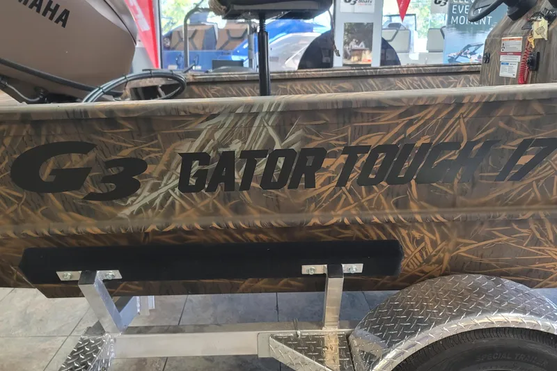 Slide: The Image of 2026 G3 Gator Tough 17CC boat with camouflage design on display. - 19