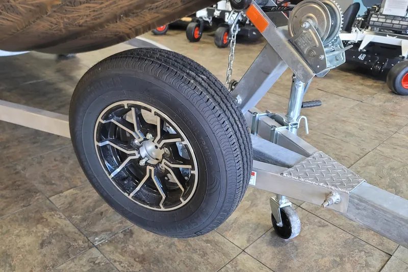 Slide: The Image of Trailer wheel and hitch of a 2026 G3 17CC boat on tiled floor. - 21