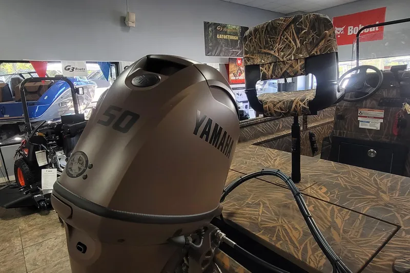 Slide: The Image of Yamaha 50 outboard motor on G3 17CC boat, camo interior, showroom display. - 7