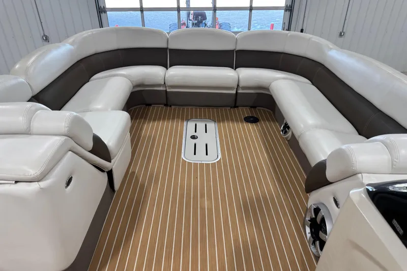 Slide: The Image of Luxurious interior of 2014 Premier 290 Grand Isle pontoon boat with plush seating. - 12