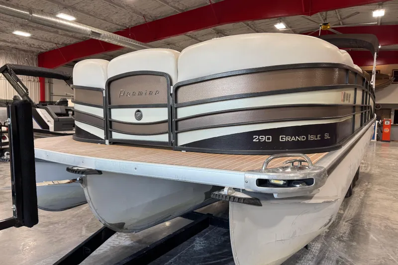 Slide: The Image of 2014 Premier 290 Grand Isle pontoon boat in indoor showroom setting. - 14