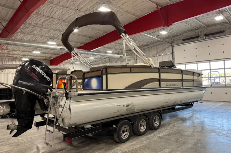 Slide: The Image of 2014 Premier 290 Grand Isle 10' Wide pontoon boat on trailer in indoor storage. - 3