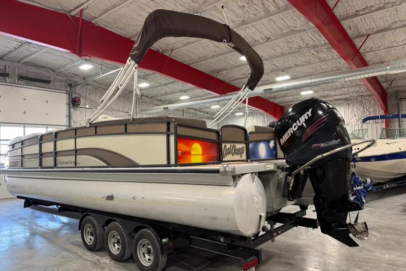 Slide: The Image of 2014 Premier 290 Grand Isle pontoon boat with Mercury outboard motor in a warehouse. - 4