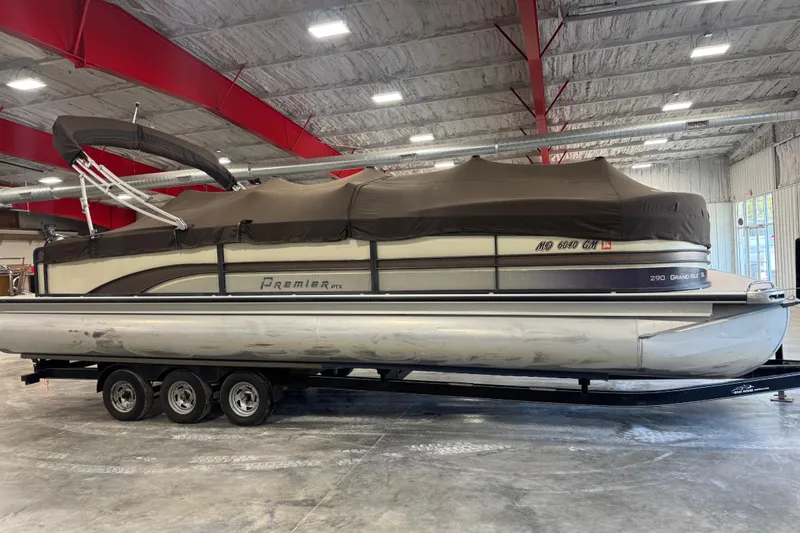 Slide: The Image of 2014 Premier 290 Grand Isle pontoon boat in indoor storage on a trailer. - 6
