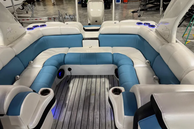 Slide: The Image of Luxurious interior of 2015 South Bay 925 Super Sport pontoon boat with blue and white seating. - 15