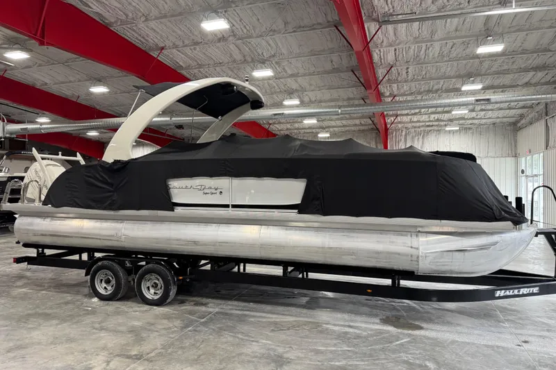 Slide: The Image of 2015 South Bay 925 Super Sport pontoon boat covered in a warehouse. - 17