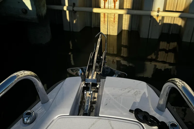 Slide: The Image of Bow of 2023 Axopar 28 CABIN boat near dock. - 11