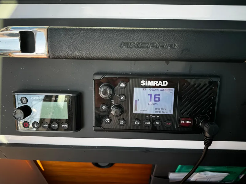 Slide: The Image of Simrad marine electronics on 2023 Axopar 28 CABIN dashboard. - 5