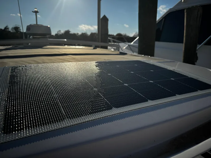 Slide: The Image of Solar panel on 2023 Axopar 28 CABIN boat under sunlight at dock. - 7