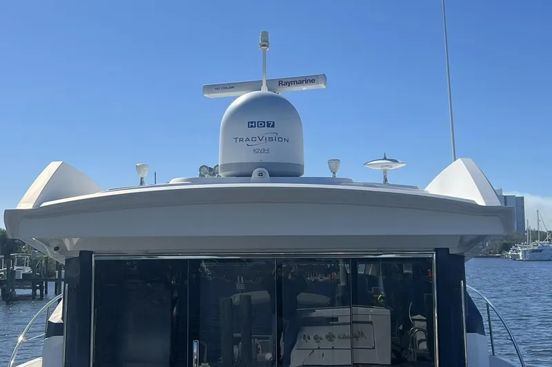 Slide: The Image of Engine room of 2019 Sea Ray L550 yacht, showcasing mechanical components and wiring. - 103