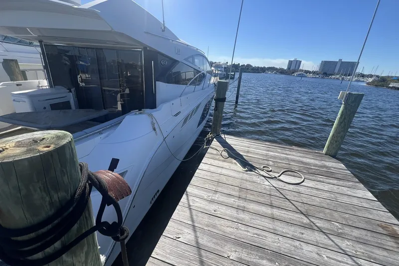 Slide: The Image of Engine compartment of a 2019 Sea Ray L550 yacht, showcasing mechanical components. - 105